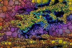 Farbiges Mosaik, bestehend aus vielen kleinen, unregelmäßig geformten Steinchen. Farbiges Mosaik, bestehend aus vielen kleinen, unregelmäßig geformten Steinchen.